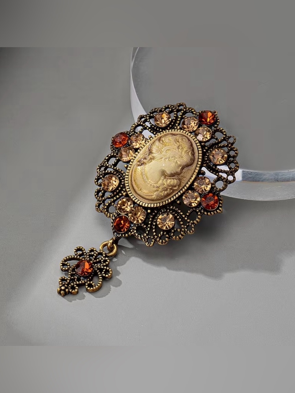 vintage-style brooch cream-colored lady portrait cameo amber-toned rhinestones